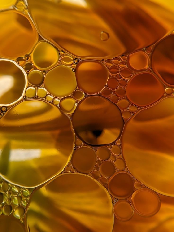 Orange and yellow bubbles on a textured surface