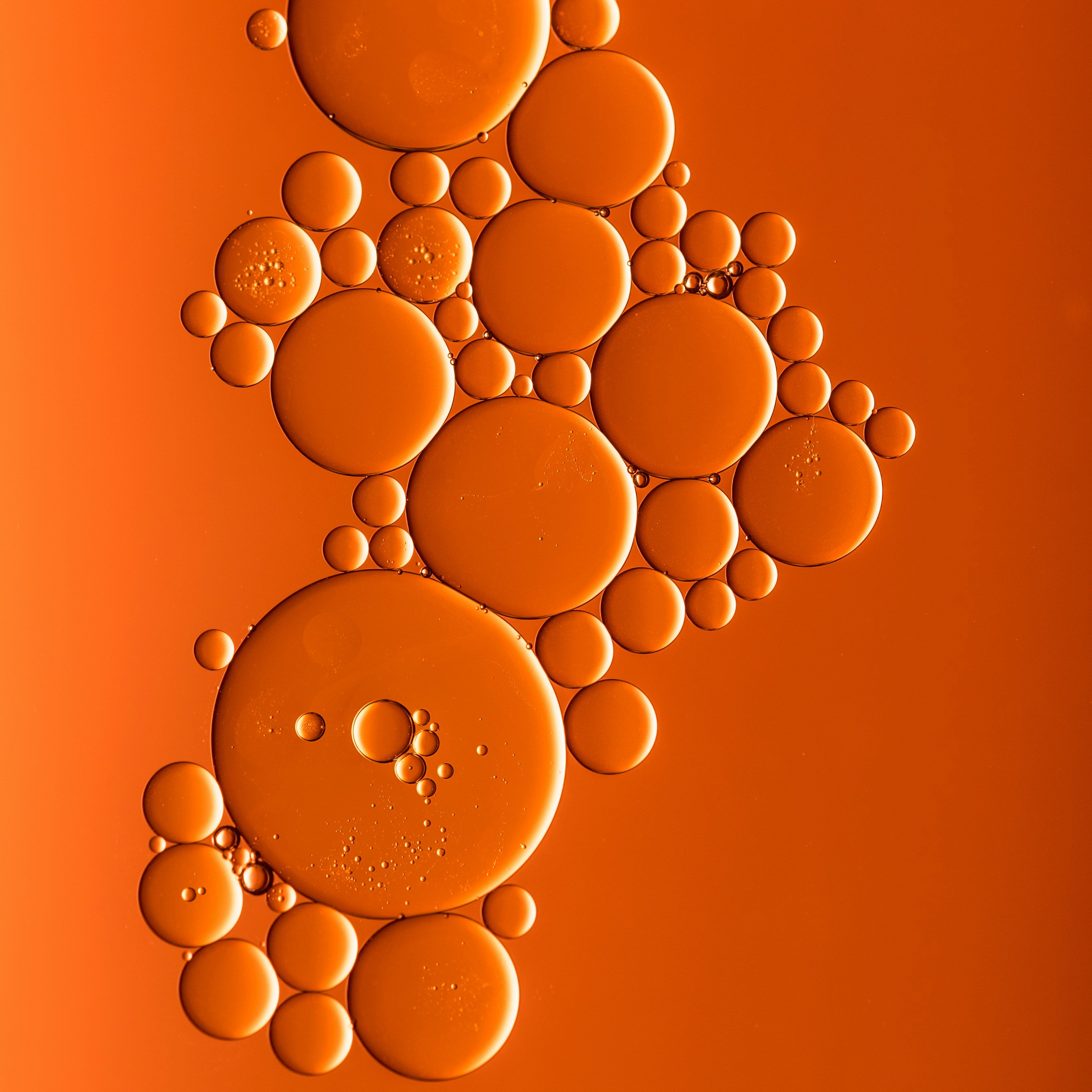 Bubbles arranged in a pattern on an orange background