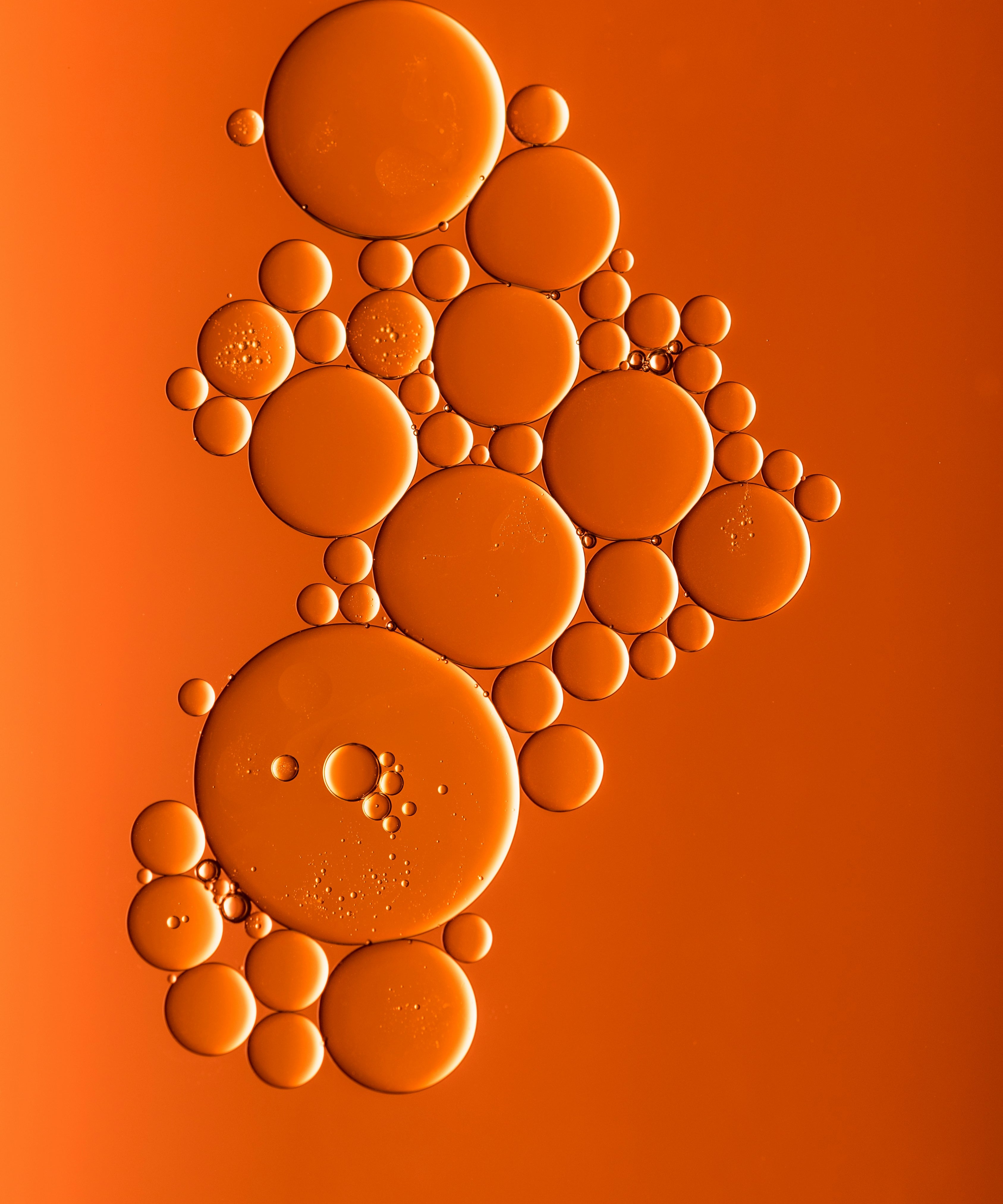Bubbles arranged in a pattern on an orange background
