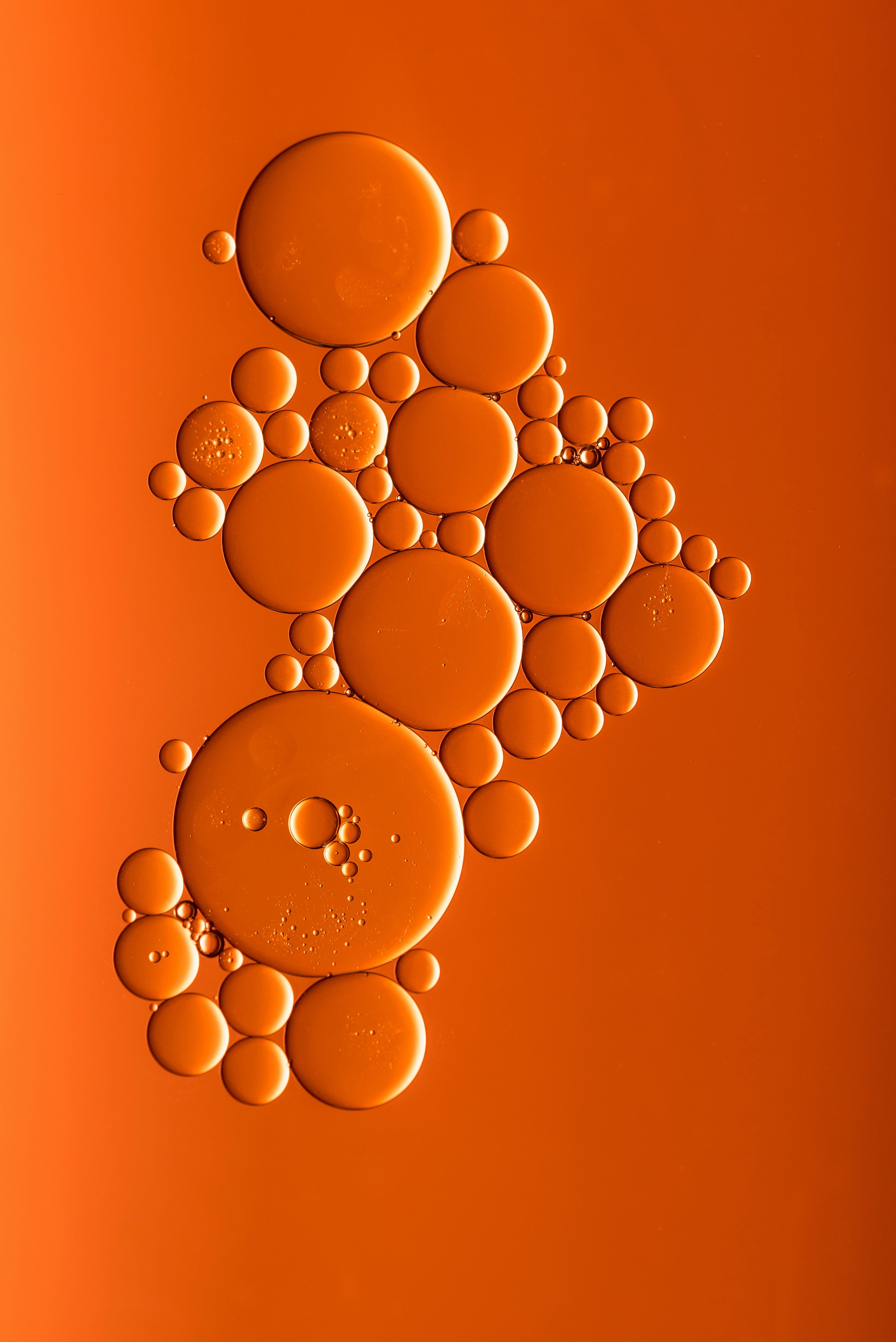 Bubbles arranged in a pattern on an orange background